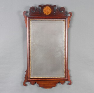 A 19th Century rectangular bevelled plate Chippendale style wall mirror contained in a shaped mahogany frame 67cm h x 38cm 