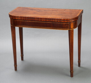 A Georgian crossbanded mahogany D shaped card table, raised on square tapered supports 75cm h x 86cm w x 43cm d 