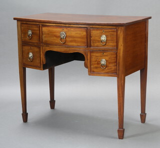 A Georgian mahogany bow front sideboard fitted a drawer flanked by 4 short drawers with replacement lion ring mask handles, raised on square tapered supports 88cm h x 99cm w x 57cm d 
