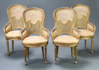 A set of 4 1920's gilt carved wood and plaster high back salon chairs with woven cane panels and over stuffed seats, raised on turned and reeded supports 105cm h x 56cm w x 51cm d (seat 38cm x 35cm) 