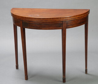 A 19th Century mahogany demi-lune and crossbanded card table raised on square tapered supports, spade feet 74cm h x 90cm w x 44cm d 