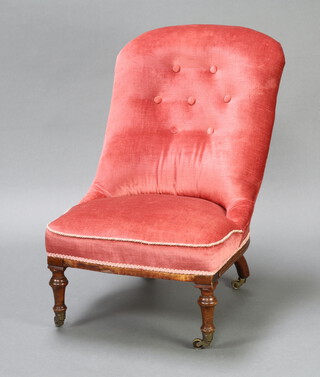 A Victorian nursing chair upholstered in rose pink buttoned Dralon, raised on turned supports 63cm h x 54cm w x 58cm d (seat 35cm x 31cm) 