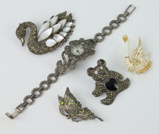 A silver and marcasite swan brooch, 3 other brooches and a wristwatch 