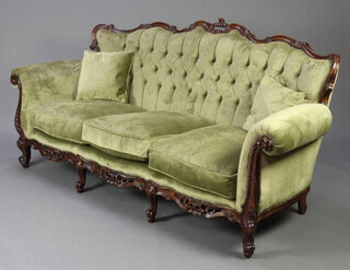 A Victorian French style mahogany show frame 3 piece settee suite comprising 3 seat settee 92cm h x 190cm w x 66cm d  (seat 150cm x 57cm) and 2 matching armchairs 90cm h x 94cm w x 61cm d (seat 41cm w x 49cm d)  upholstered in green buttoned dralon, raised on cabriole supports 
