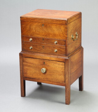A Georgian Anglo Indian rectangular mahogany cabinet, the hinged lid revealing a fitted interior above 2 short drawers with brass carrying handles to the sides, raised on an associated separate base fitted a drawer 69cm h x 44cm w x 33cm d 