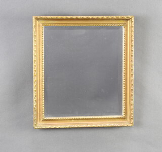 A 19th Century rectangular bevelled plate wall mirror contained in a decorative gilt frame 30cm x 26cm 