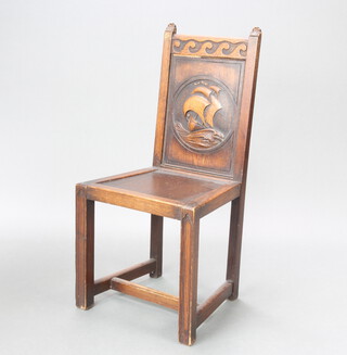 A 1920's carved oak hall chair with solid back carved a galleon, raised on square supports 96cm h x 45cm w x 42cm d (seat 31cm x 28cm) 