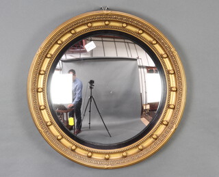 A Georgian style circular convex plate wall mirror contained in a ball studded frame 50cm diam. 