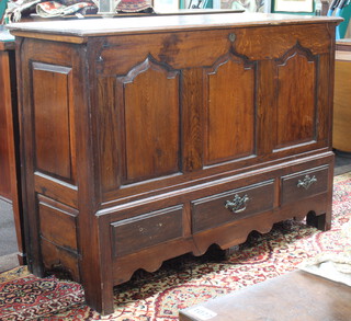 A 17th/18th Century oak mule chest with hinged lid, the base fitted 3 drawers 97cm h x 138cm w x 51cm d 