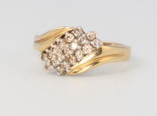 An 18ct yellow gold crossover diamond ring, size M 1/2, 4.3 grams 