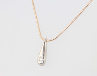 A 14ct rose gold diamond set pendant and chain 4.2 grams, 40cm 