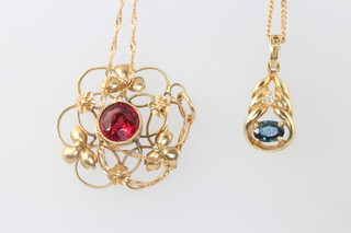 Two 9ct yellow gold chains with garnet and sapphire set pendants, 6.5 grams gross 