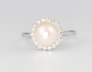 A 9ct white gold cultured pearl and diamond cluster ring, diamonds 0.37ct, size N, 3.6 grams