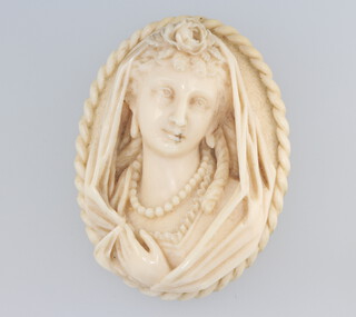 A Victorian carved ivory portrait brooch 6cm 