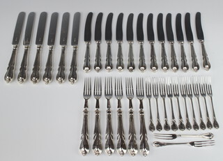 Twelve silver plated lily pattern butter knives, 6 pairs of ditto plated dessert eaters and 12 ditto 3 prong forks  
