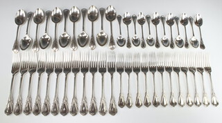 Twelve silver plated lily pattern dinner forks, 12 dessert forks, 11 dessert spoons and 12 teaspoons together with 12 Edwardian lily pattern ivory handled dinner knives