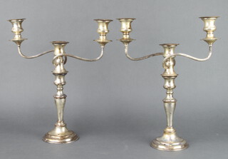 A pair of silver plated 3 light candelabra on tapered stems 38cm 