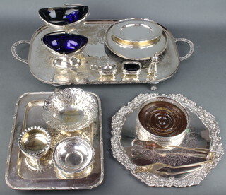 A silver plated 2 handled tray 59cm, two plated swing handled baskets with blue glass liners and minor plated wares 