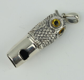 A sterling silver repousse owl whistle with glass eyes 4cm 