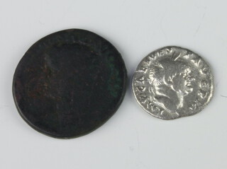A Roman silver coin - Vespasian 69-79 AD and a bronze coin Claudius I 41-42 