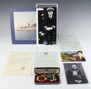 An Elizabeth II Royal Naval Reserve decoration and bar together with miniature, with associated letters and photographs to Lieutenant Commander A W Lane 