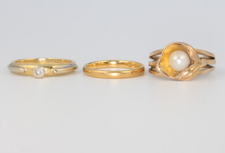 An 18ct yellow gold ring size L, 3.3 grams, a 9ct gem set ditto 4.7 grams, size M and a 22ct gold wedding band size J 2.4 grams 