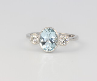 A platinum aquamarine and diamond ring, the centre oval cut stone 1.75ct, the 2 brilliant cut diamonds 0.42ct size N 1/2, 4.5 grams 