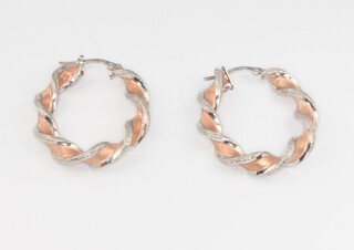 A pair of 2 colour 9ct gold twist hoop earrings 3.5 grams