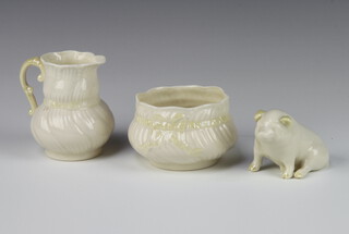 A Belleek porcelain baluster jug with mottled bow, green mark 9cm, a ditto bowl 6cm and a seated pig, yellow mark 5cm 