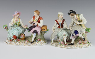 A pair of modern Sitzendorf porcelain groups of a bird seller and flower girl and a shepherd and shepherdess with applied flowers, raised on rococo bases 12cm 