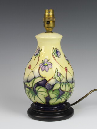Moorcroft, a contemporary baluster shaped yellow ground Hepatica pattern table lamp 27cm 