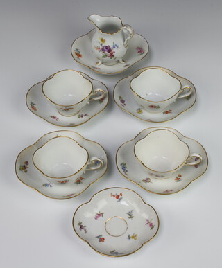 A 20th Century Meissen tea set comprising cream jug, 4 quatrefoil tea cups (1 chipped) together with a 6 saucers (4 chipped) 