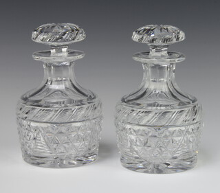 A pair of Georgian design mallet shaped decanters with mushroom stoppers 19cm 