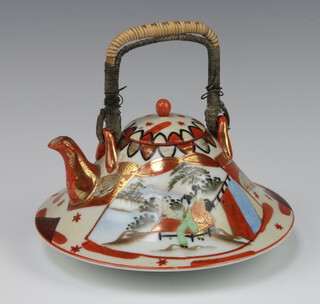 A Japanese Kutani style saki kettle decorated with panels of figures 10cm 