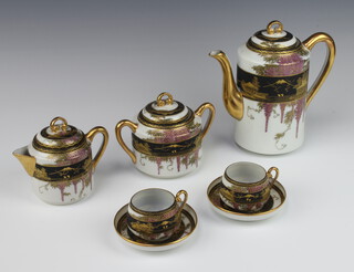 A 1920's Japanese porcelain coffee set decorated with views of Mount Fuji comprising coffee pot, 2 cups and saucers, sugar bowl, lidded milk jug 