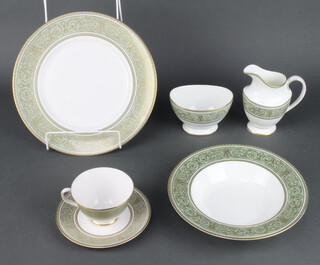 A Royal Doulton English Renaissance pattern part tea and dinner service comprising 6 tea cups, 12 saucers, 6 side plates, 6 dinner plates, 6 soup bowls (seconds), a cake plate, an oval meat plate, sugar bowl and cream jug 