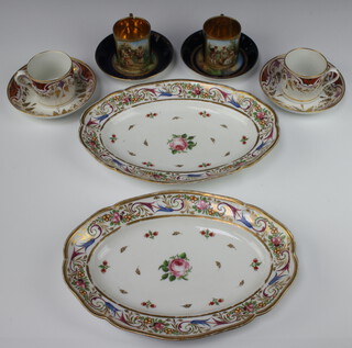 A pair of 19th Century Austrian cabinet cups and saucers with blue and gilt grounds decorated with fete gallant scenes (both cups are a/f, saucers are rubbed) together with 2 19th Century coffee cans and saucers with gilt vinous decoration and 2 German oval dishes decorated flowers (rubbed gilding) 