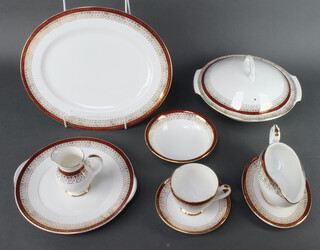 A Royal Grafton Majestic pattern part tea and dinner service comprising 12 tea cups (seconds), 12 saucers (3 cracked), cream jug, milk jug (cracked), 14 small plates (1 cracked), 11 side plates, 11 dinner plates, a sandwich plate, oval meat plate, sauce boat and stand, sugar bowl, 3 tureens and covers, 12 dessert bowls (1 cracked)