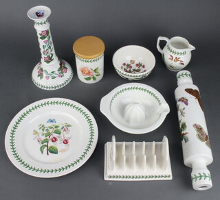 A large quantity of Portmeirion Botanic Garden tableware comprising 7 storage jars and covers, a soup tureen, lid and ladle (lid chipped), candlestick, a soap dispenser, small bowl, rectangular pie dish, tray, 2 handled tray, placemat, 4 dessert bowls, 9 side plates, 13 dinner plates, 9 dessert bowls, 6 small plates, heart shaped basket, pestle and mortar, 3 jugs, lemon squeezer, cheese cover and stand, butter dish and cover, 2 lidded jars, a lidded jar, cover and stand, rolling pin, meat plate, toast rack, cake plate and 1 similar  