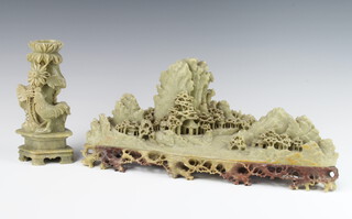 A soapstone carving of an extensive mountainous landscape with buildings and trees 36cm together with a vase decorated a cockerell beneath flowers 18cm 