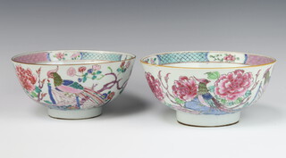 A pair of 18th Century famille rose bowls decorated with birds amongst flowers 20cm 