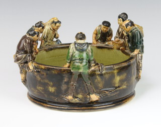 A Chinese slip glazed bowl in the form of 6 figures and a monkey looking over the rim 17cm 