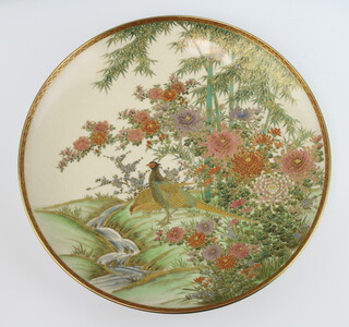 An early 20th Century Satsuma dish decorated with exotic birds beneath flowering trees 31cm 
