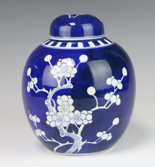 A blue and white prunus ginger jar and cover with double ring mark base 20cm 