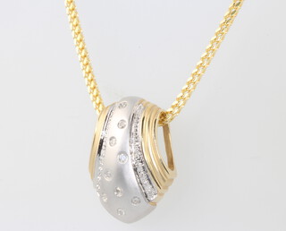 A 14ct two colour gold diamond set pendant and chain 16.7 grams