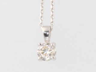 An 18ct white gold single stone diamond pendant 0.7ct on an 18ct white gold chain 38cm, 3.3 grams 