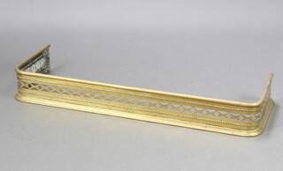 A Victorian pierced brass fender 12cm h x 92cm w x 31cm d 