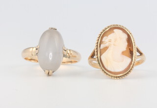 An 18ct yellow gold cameo ring size L, 2.49 grams and a yellow metal moonstone ring size N 1/2 4.3 grams 