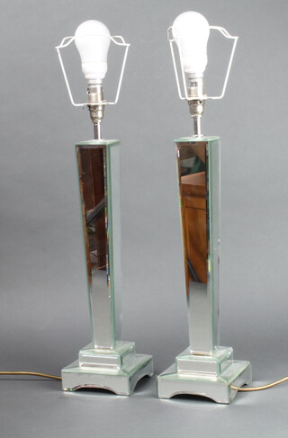 A pair of Art Deco style faceted tapered glass mirrored table lamps raised on square bases 42cm h x 12cm w x 12cm d  