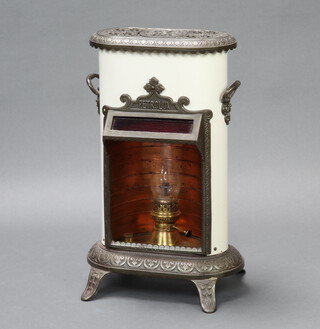 A Petrolux iron and white enamelled oval twin handled stove, raised on panel supports 67cm h x 40cm w x 21cm d 